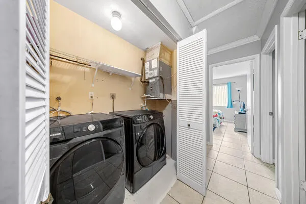 a utility room with dryer and washer