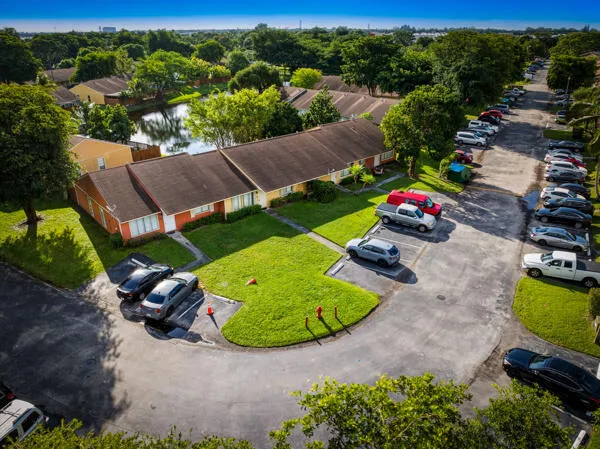 an aerial view of a house with garden space and street view