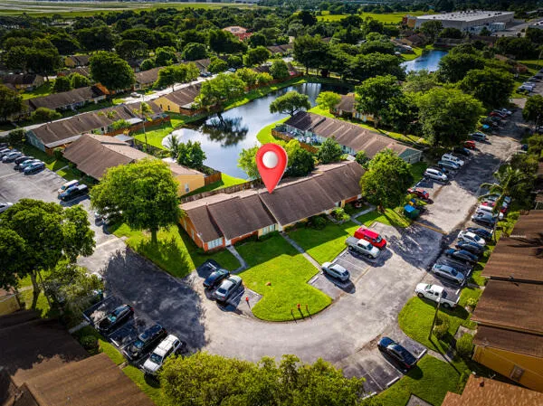 an aerial view of a house with yard swimming pool and outdoor seating