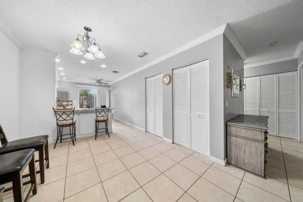 a view of a room with kitchen appliances and dining area