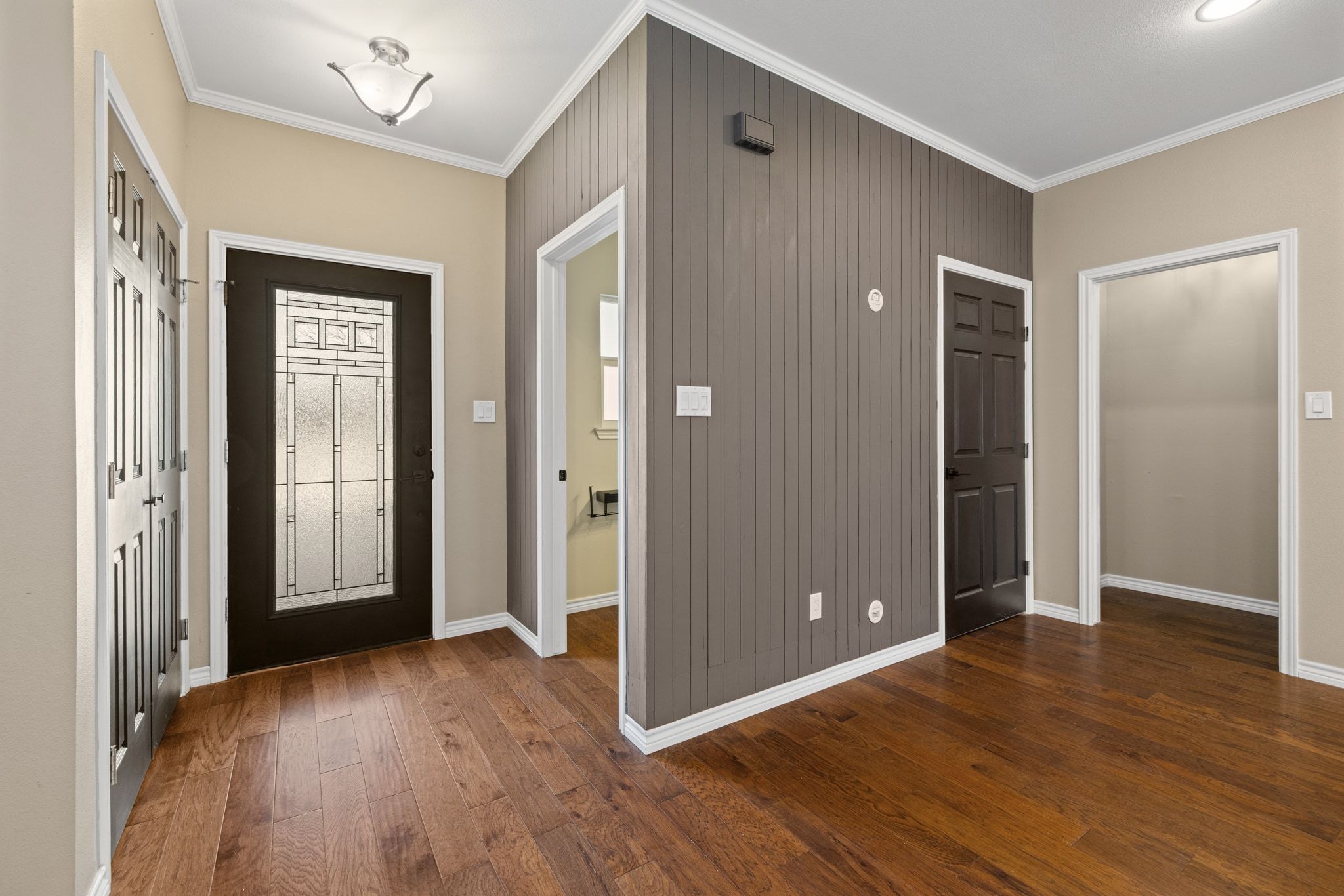 609 A West 7th Street Taylor, TX 76574 - Photo 11 of 35 an empty room with wooden floor and windows