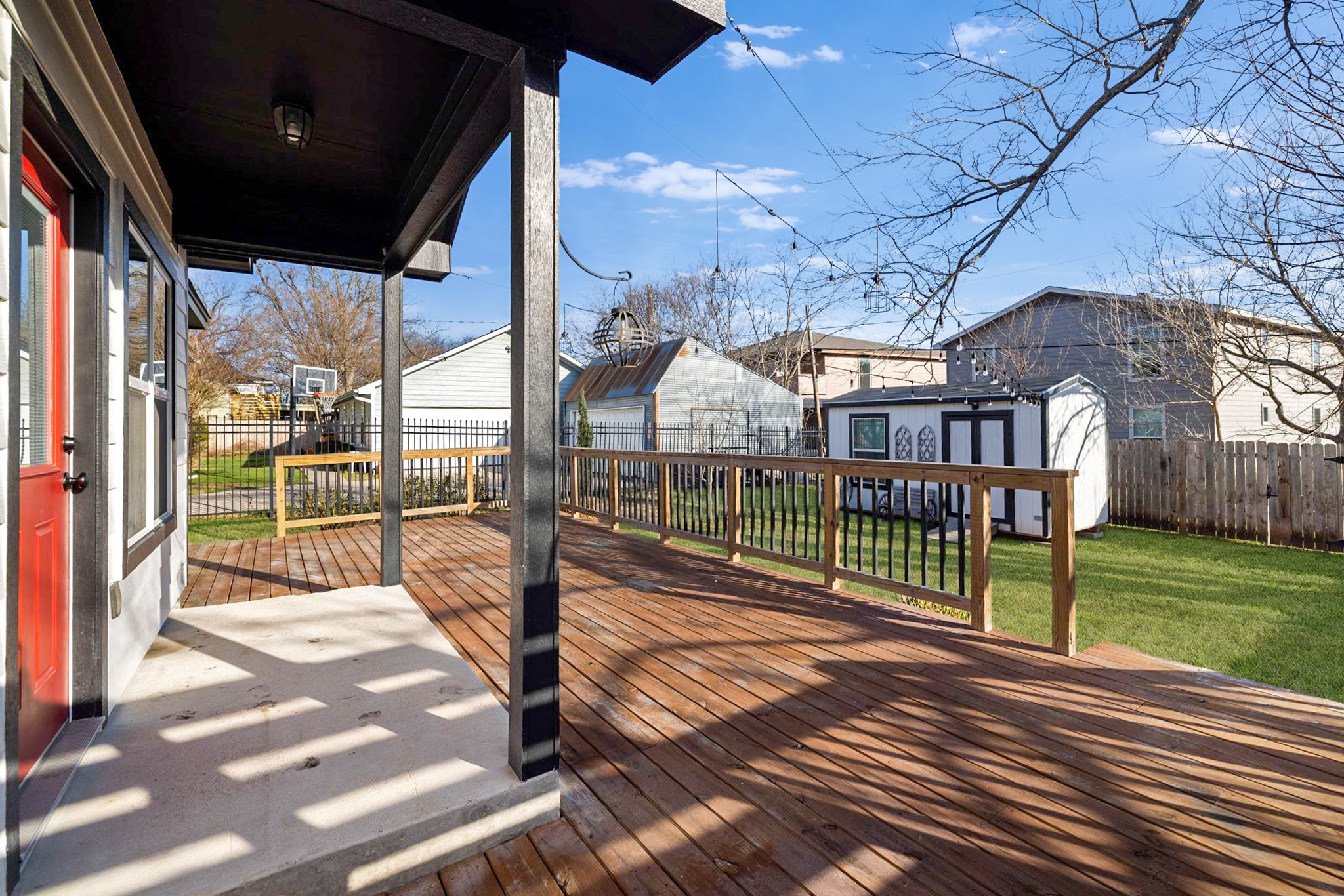 609 A West 7th Street Taylor, TX 76574 - Photo 22 of 35 a view of a porch with wooden fence and a yard