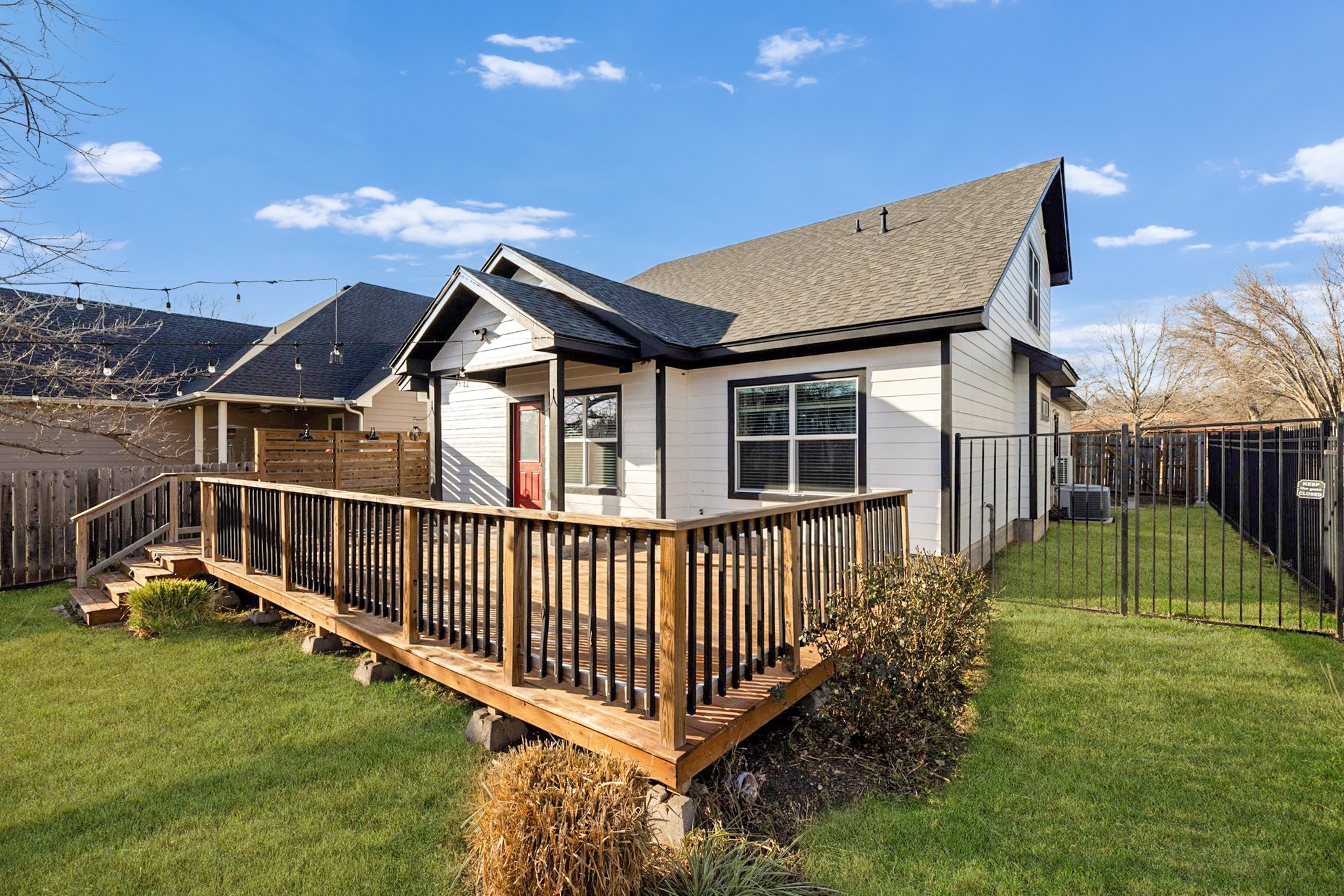 609 A West 7th Street Taylor, TX 76574 - Photo 25 of 35 a backyard of a house with table and chairs
