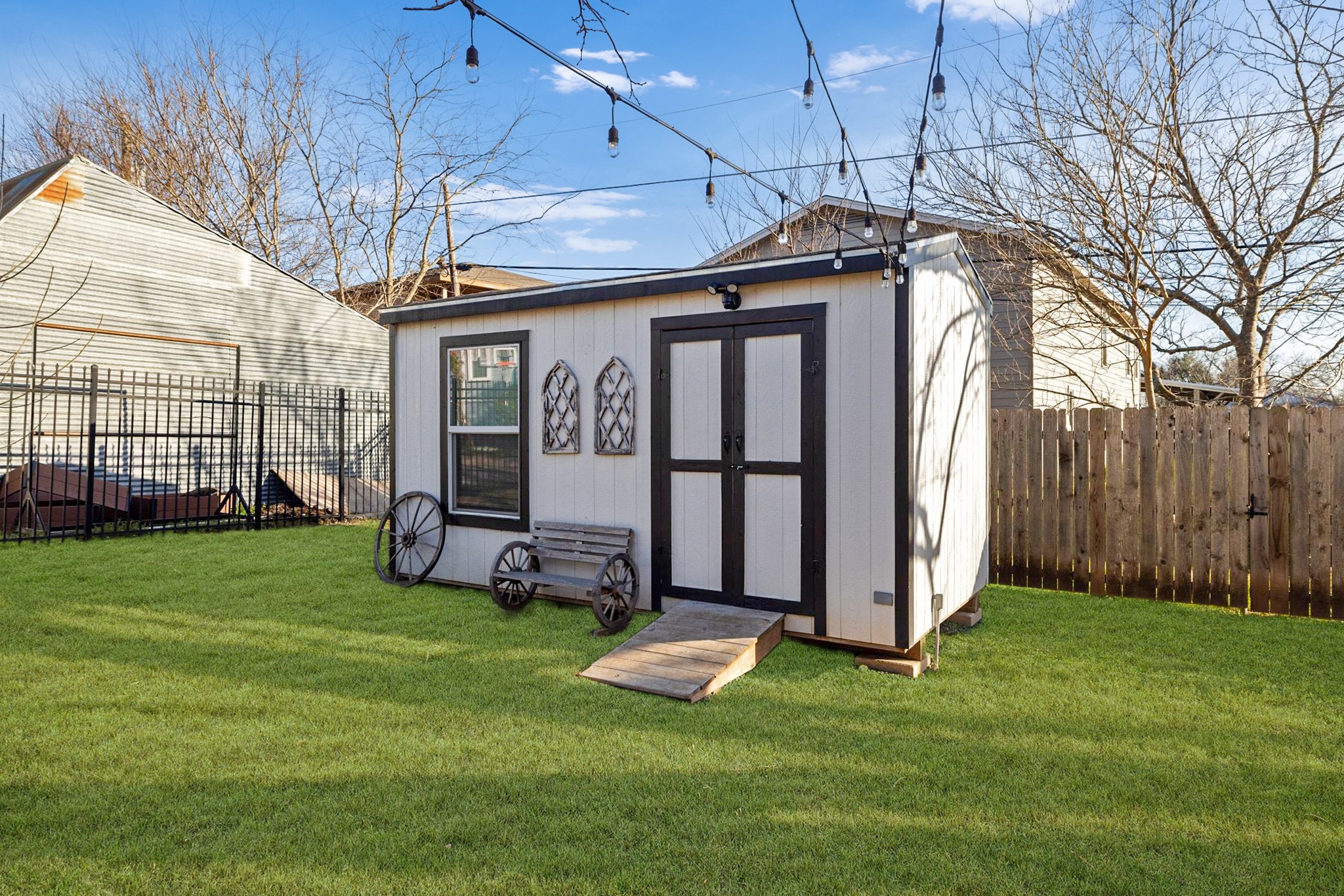 609 A West 7th Street Taylor, TX 76574 - Photo 26 of 35 a front view of a house with a yard and garage