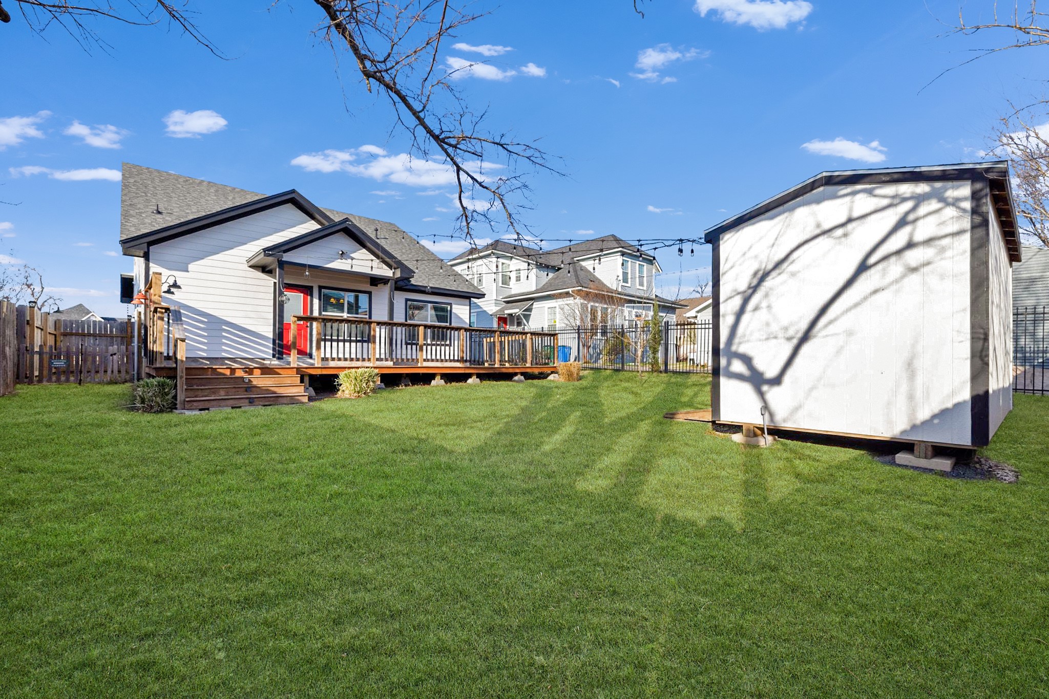 609 A West 7th Street Taylor, TX 76574 - Photo 27 of 35 a view of a house with a big yard and large trees