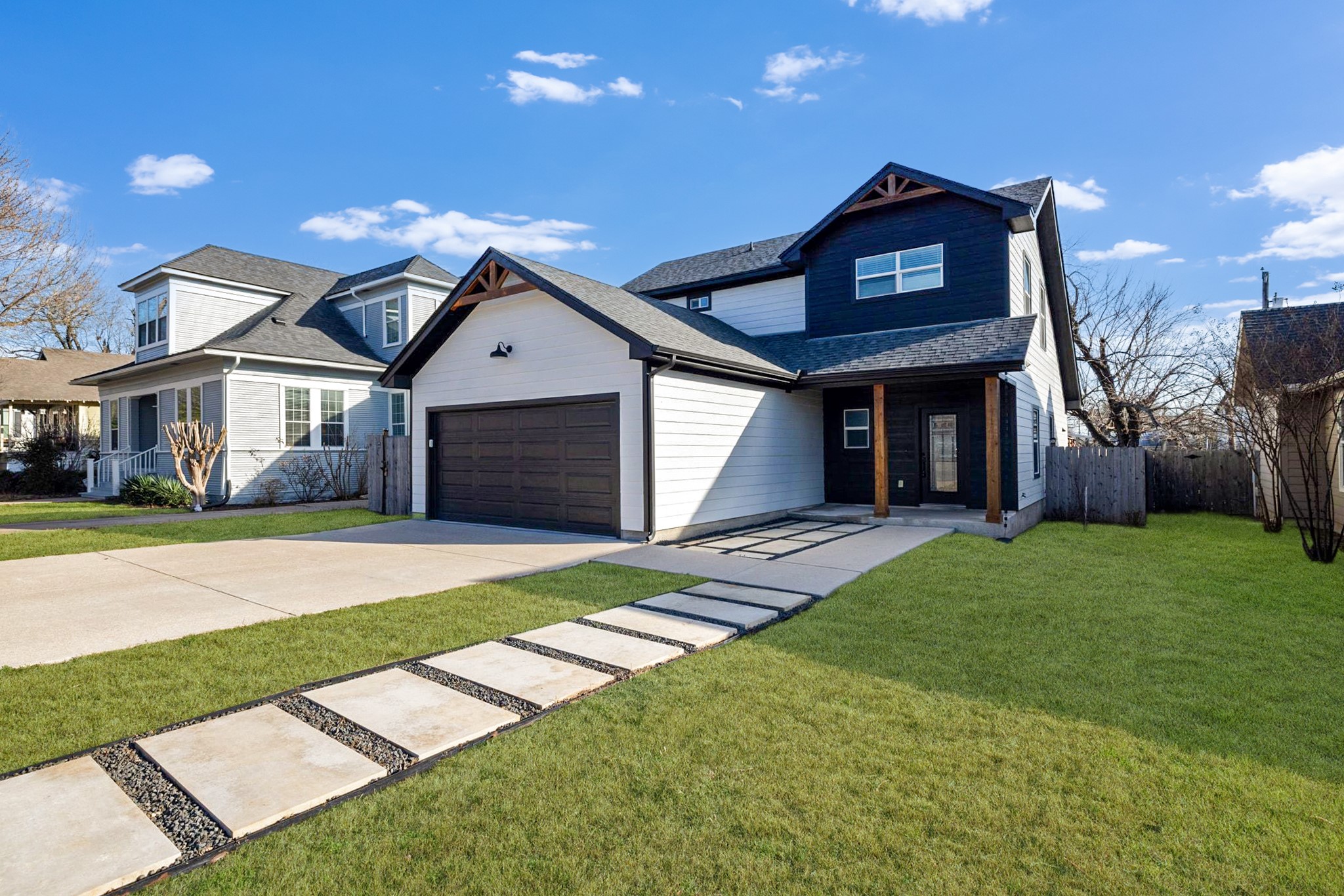 609 A West 7th Street Taylor, TX 76574 - Photo 3 of 35 a front view of a house with a yard and garage