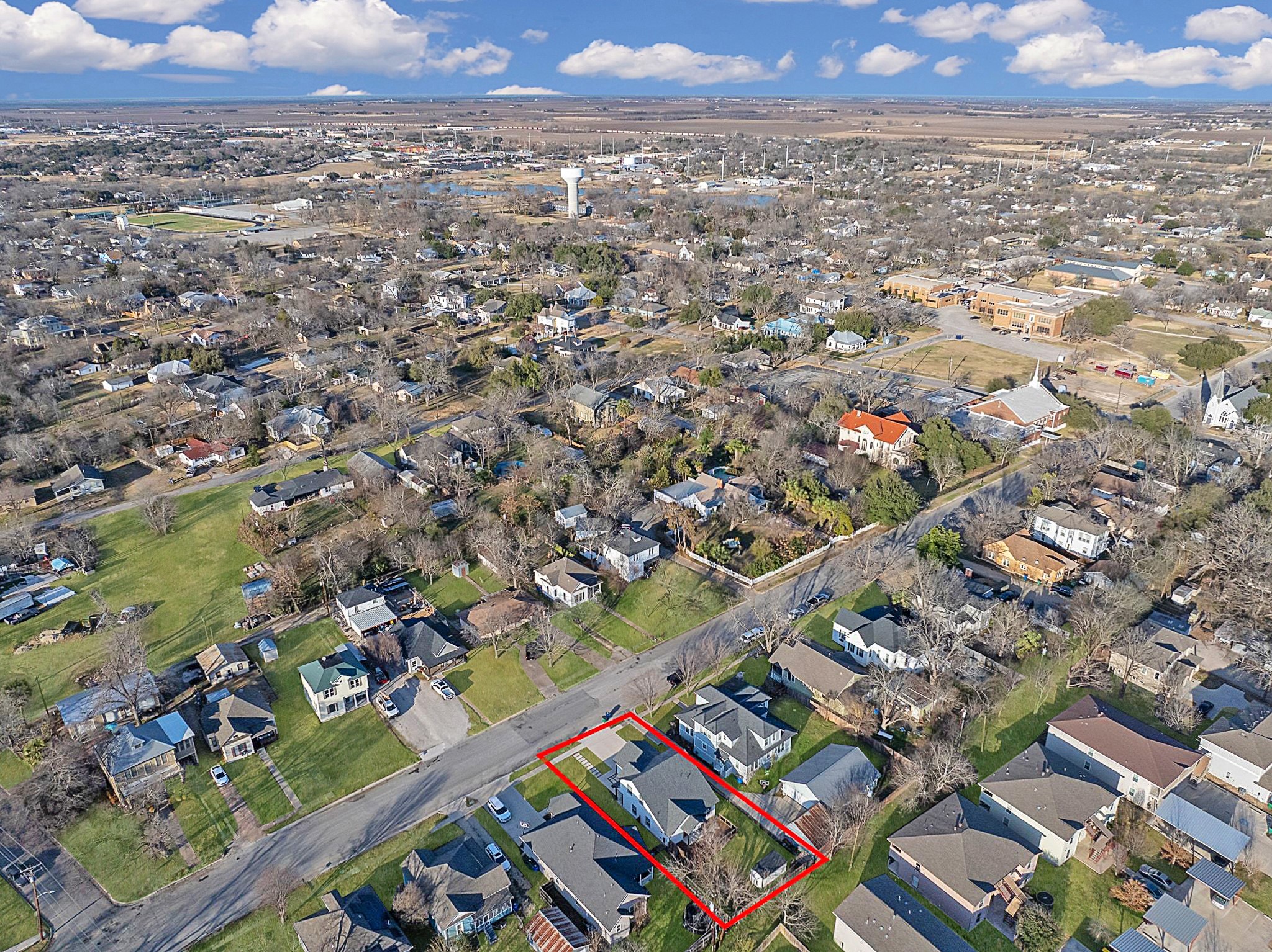 609 A West 7th Street Taylor, TX 76574 - Photo 33 of 35 Aerial view of residential area with property boundaries highlighted