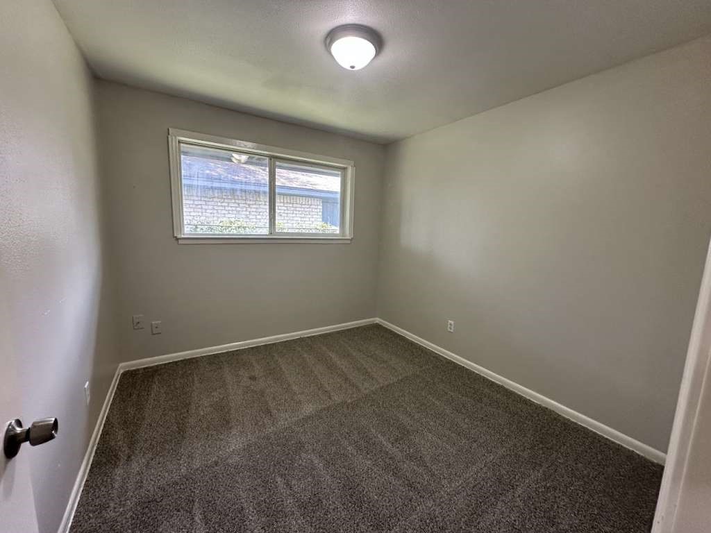 6523 Hanley Lane Houston, TX 77016 - Photo 11 of 17 an empty room with a window