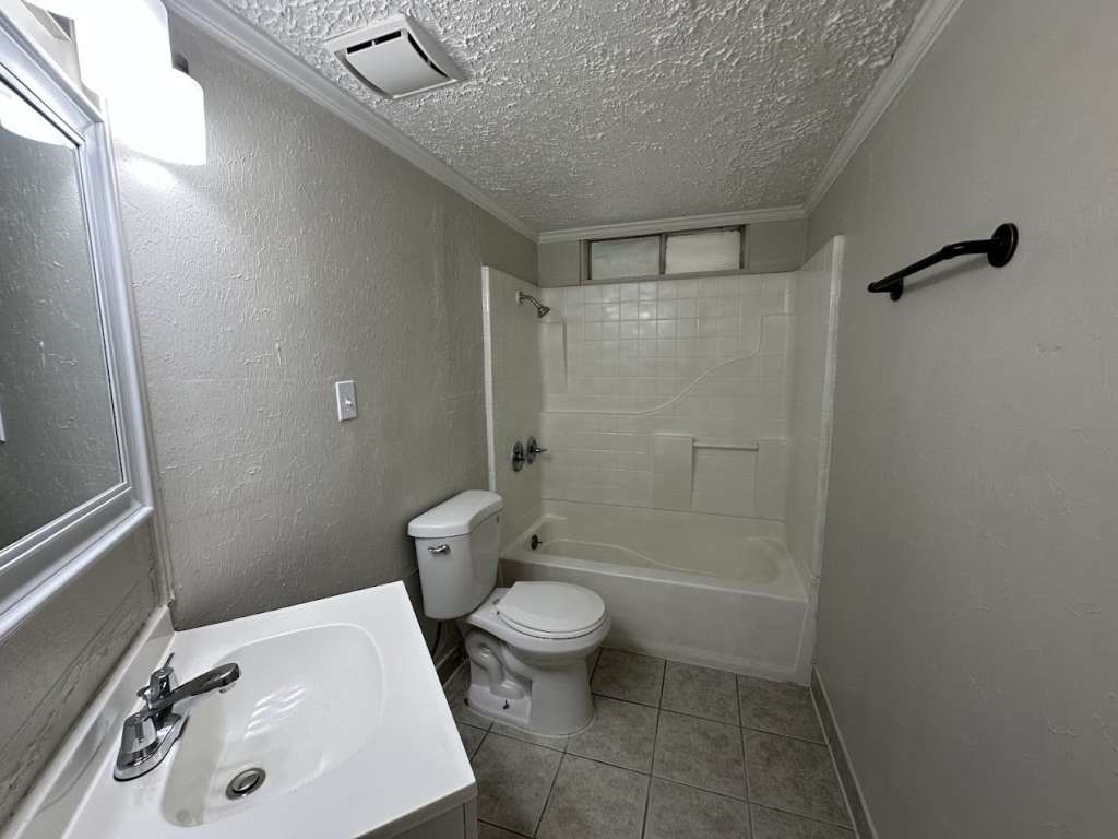 6523 Hanley Lane Houston, TX 77016 - Photo 12 of 17 a bathroom with a sink toilet and shower