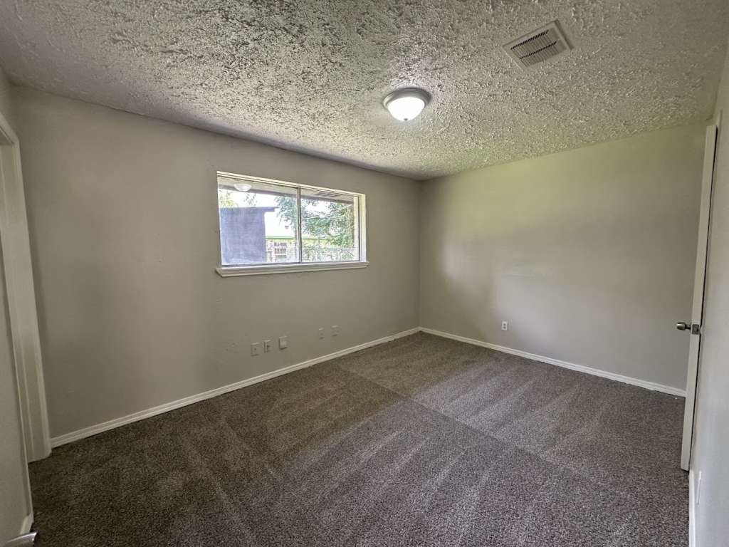 6523 Hanley Lane Houston, TX 77016 - Photo 13 of 17 an empty room with windows