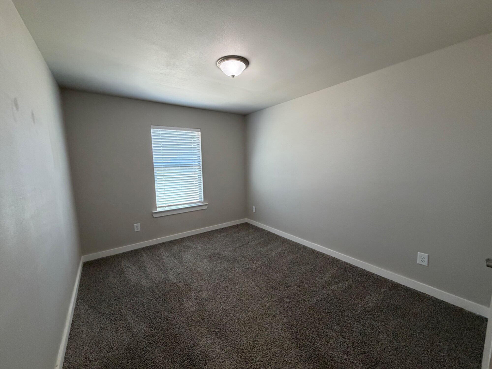 328 Ranger Street Wolfforth, TX 79382 - Photo 12 of 15 an empty room with a window