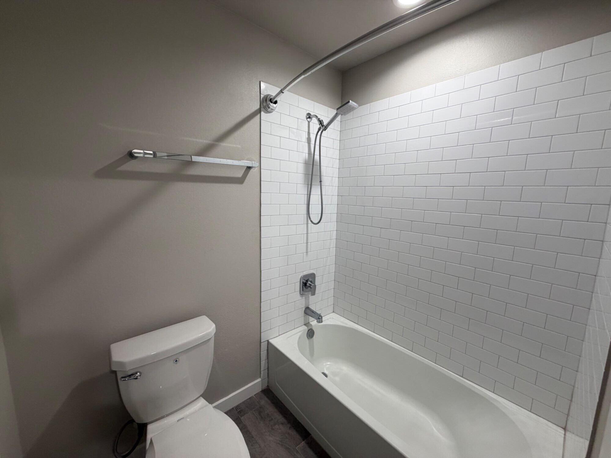 328 Ranger Street Wolfforth, TX 79382 - Photo 14 of 15 a bathroom with a toilet and a bathtub