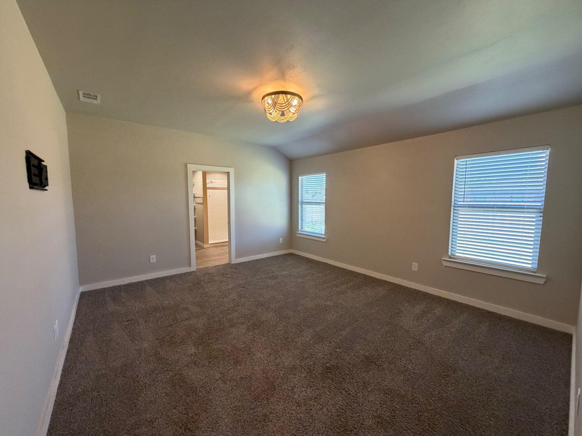 328 Ranger Street Wolfforth, TX 79382 - Photo 6 of 15 a view of an empty room with a window