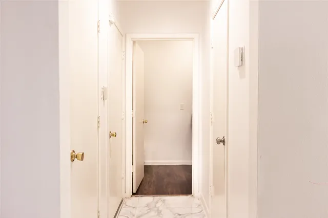 a bathroom with a glass shower door