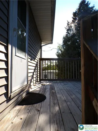 a view of balcony with wooden floor