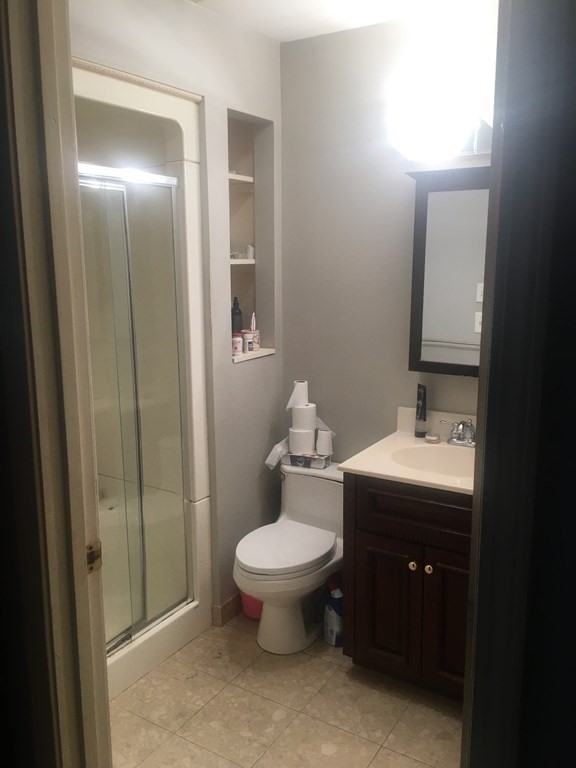 40 Hunters Run Place, Unit 40 Haverhill, MA 01832 - Photo 8 of 13 a bathroom with a toilet sink and mirror