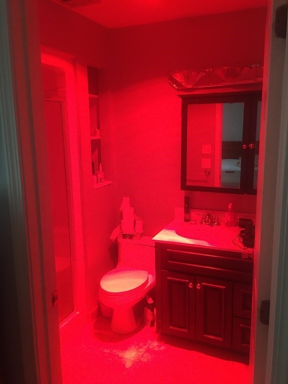 40 Hunters Run Place, Unit 40 Haverhill, MA 01832 - Photo 9 of 13 a bathroom with a toilet a sink and mirror