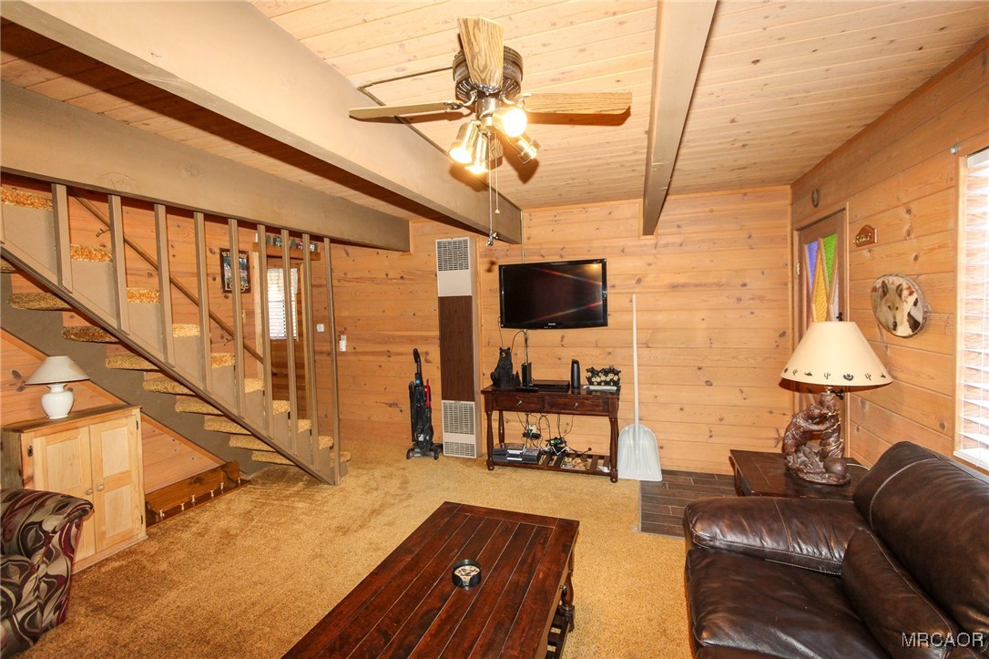 692 San Bernardino Avenue Sugarloaf, CA 92386 - Photo 3 of 20 a living room with furniture and a flat screen tv
