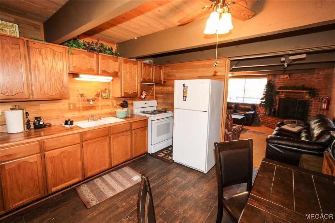 692 San Bernardino Avenue Sugarloaf, CA 92386 - Photo 8 of 20 a kitchen with refrigerator and cabinets