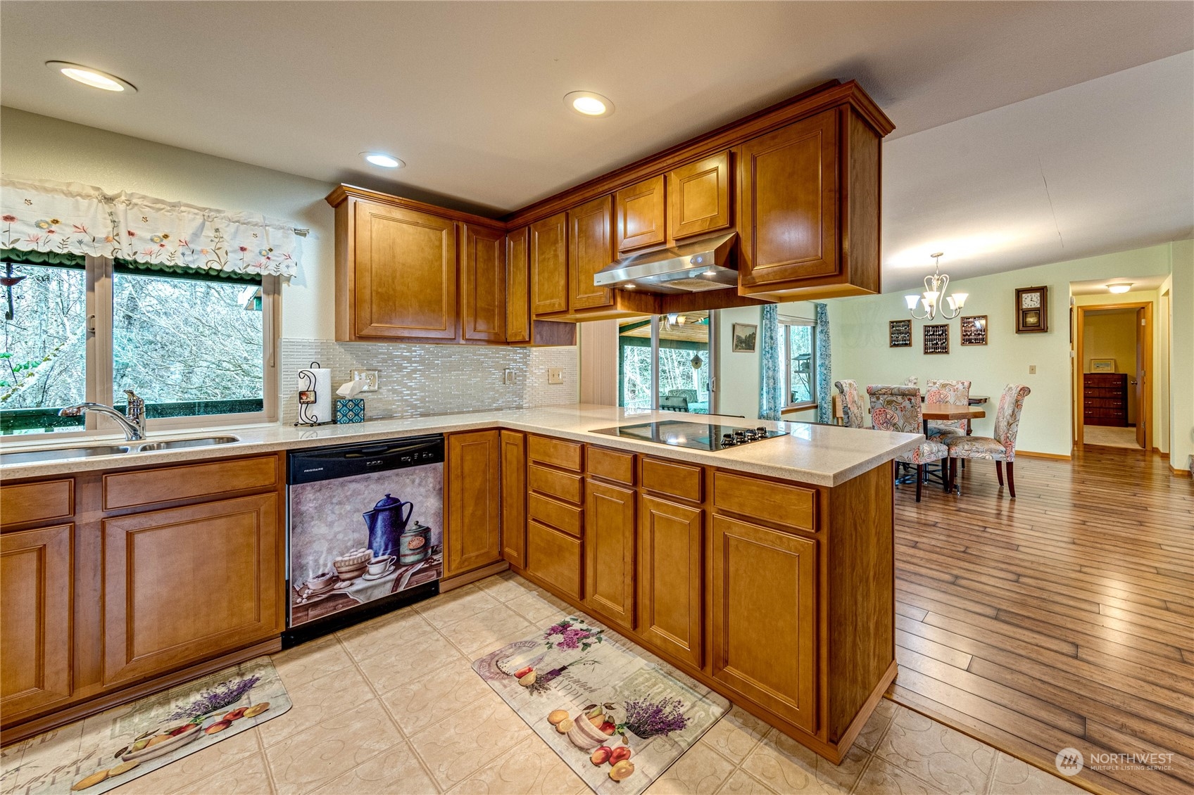 23716 Vista View Avenue Bothell, WA 98021 - Photo 11 of 29 a kitchen with stainless steel appliances granite countertop a sink a stove cabinets counter space and a window