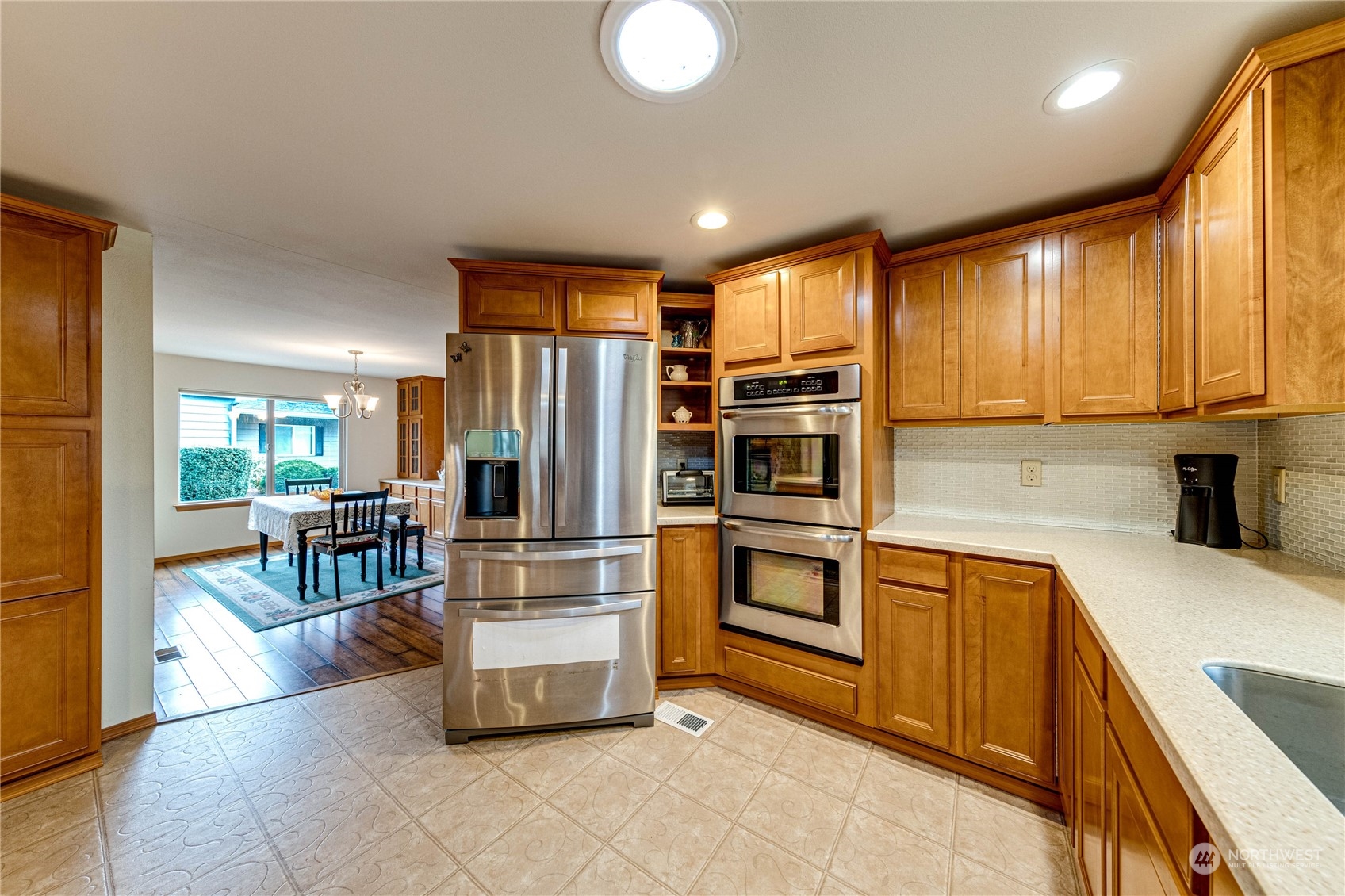 23716 Vista View Avenue Bothell, WA 98021 - Photo 13 of 29 a kitchen with refrigerator and cabinets