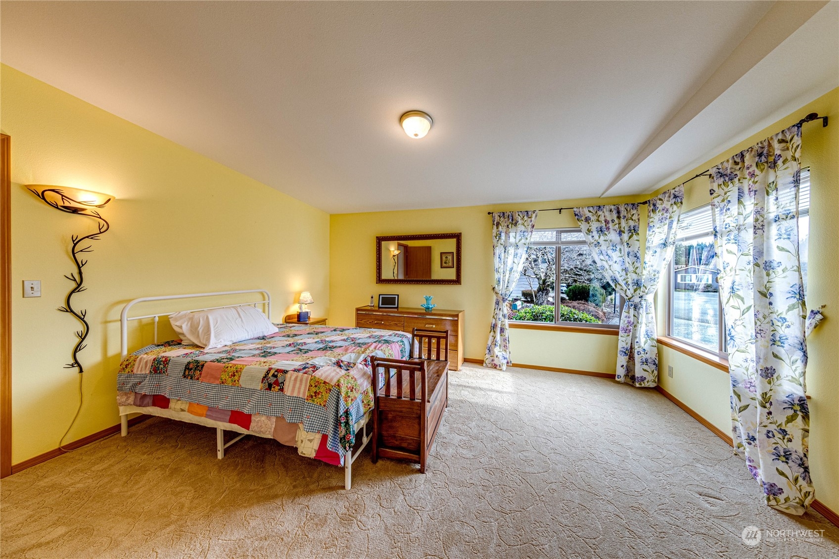 23716 Vista View Avenue Bothell, WA 98021 - Photo 16 of 29 a bed room with a bed and a chair
