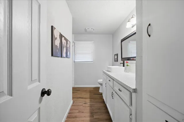 a bathroom with a double vanity sink and mirror