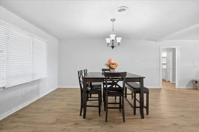 a view of a dining room and wooden floor