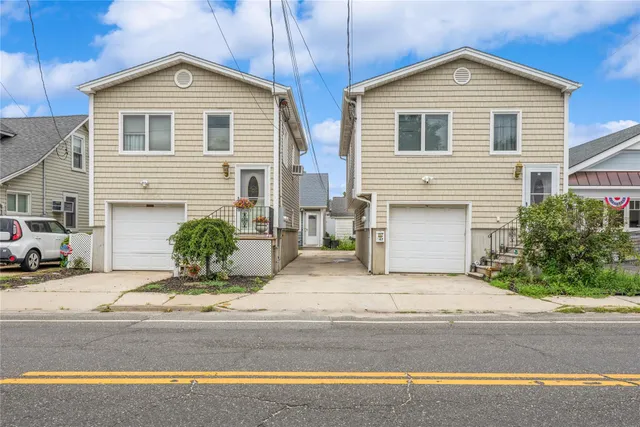 a front view of a house with yard