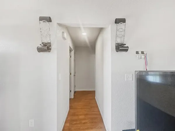 a view of a hallway with windows