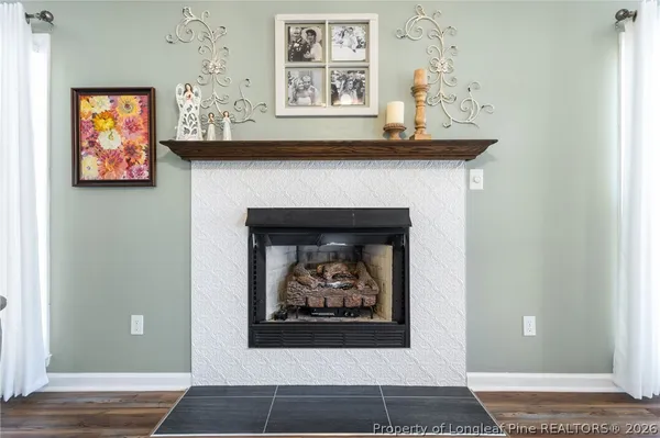 a view of fireplace and wooden floor