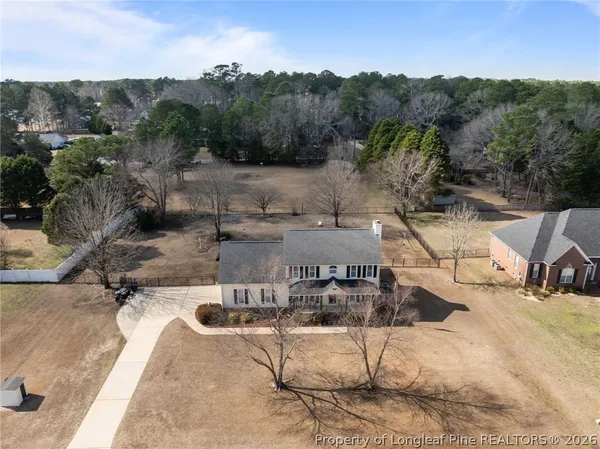 an aerial view of a house with outdoor space