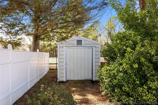 a view of a wooden door in front of a house
