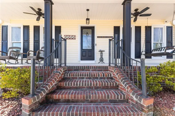 a view of a wooden deck with a yard