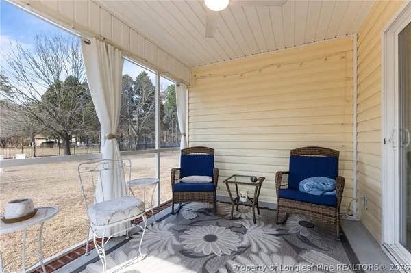 a outdoor living space with furniture and a rug