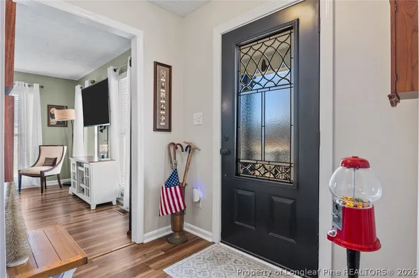 a room with furniture and wooden floor
