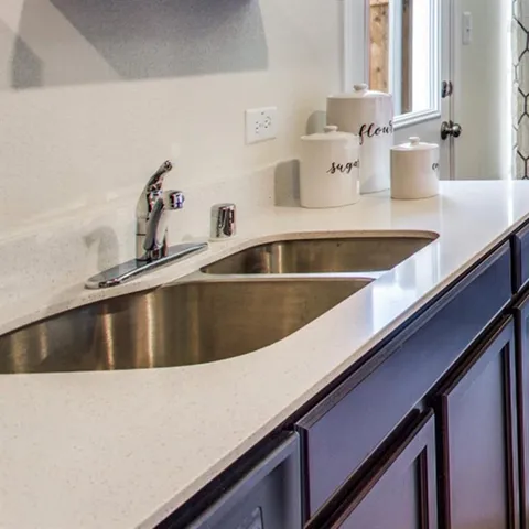 a bedroom with a bed and a night stand