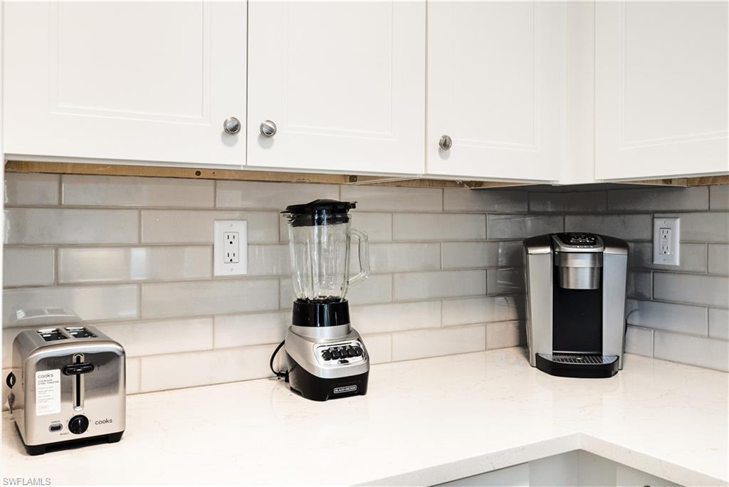 655 8th Avenue South, Unit 3 Naples, FL 34102 - Photo 21 of 48 a kitchen with a sink and cabinets
