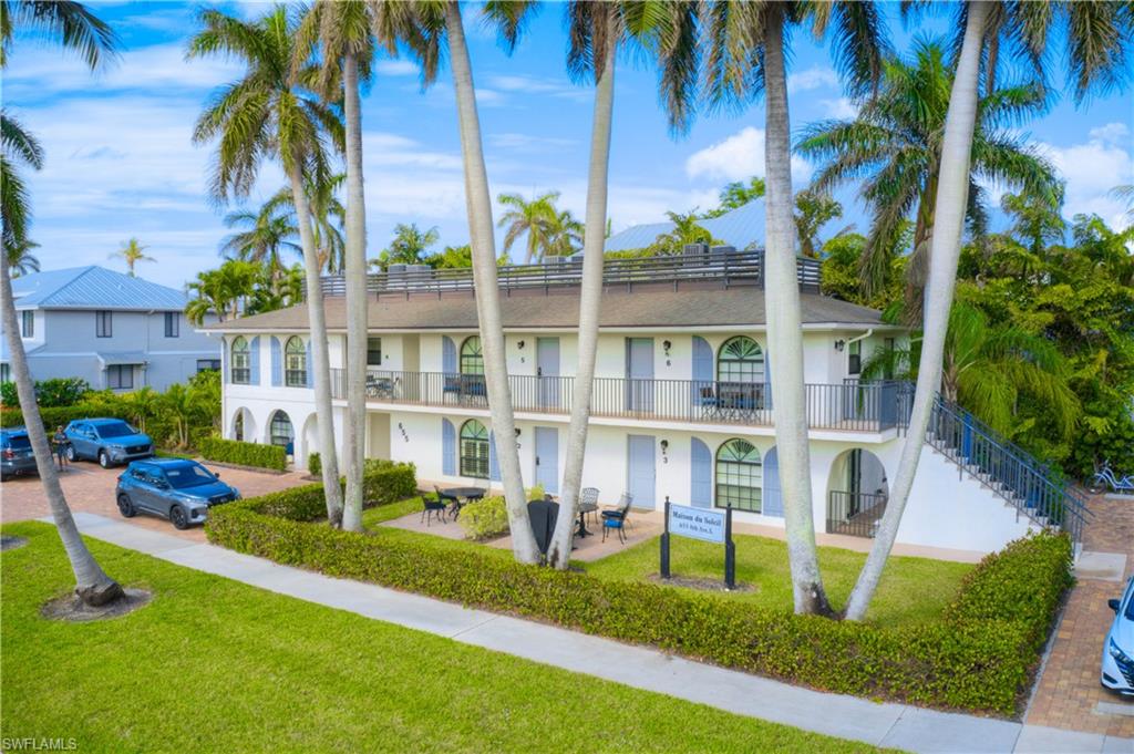 655 8th Avenue South, Unit 3 Naples, FL 34102 - Photo 38 of 48 a house with garden in front of it