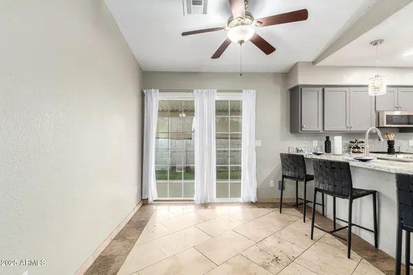 a view of a kitchen with a sink and cabinets