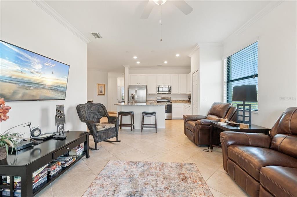 16904 Vardon Terrace, Unit 301 Lakewood Ranch, FL 34211 - Photo 13 of 28 a living room with furniture and a rug
