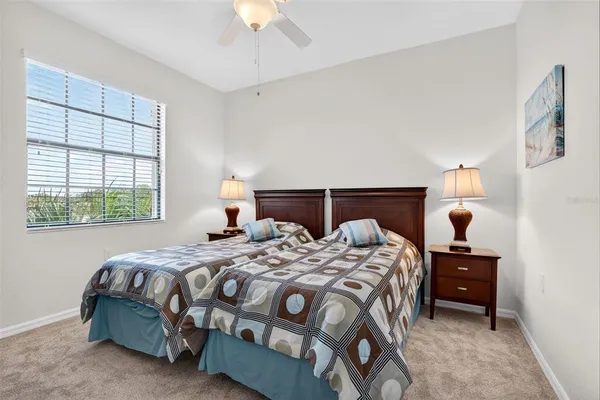 a bedroom with a bed and a television