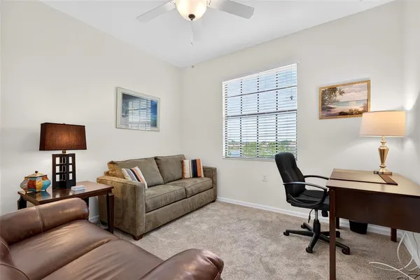 a work room with furniture and windows