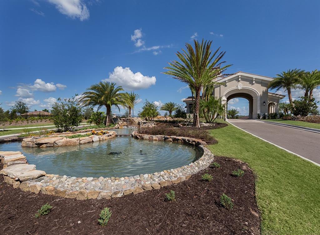 16904 Vardon Terrace, Unit 301 Lakewood Ranch, FL 34211 - Photo 32 of 53 a view of a swimming pool with a house in the background