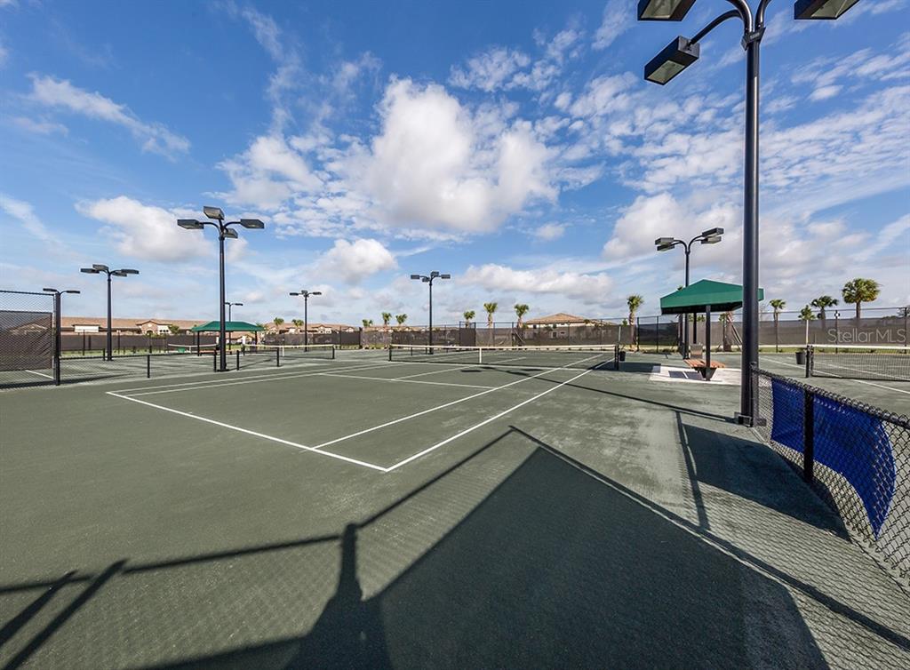 16904 Vardon Terrace, Unit 301 Lakewood Ranch, FL 34211 - Photo 42 of 53 a view of a tennis court