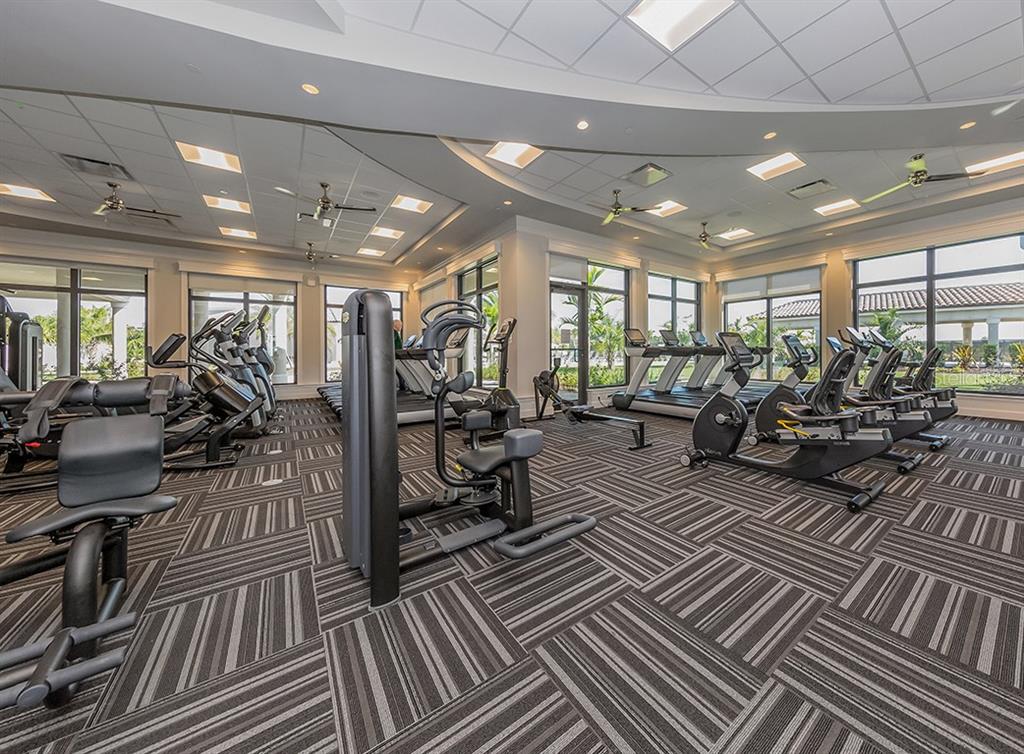 16904 Vardon Terrace, Unit 301 Lakewood Ranch, FL 34211 - Photo 47 of 53 a view of a room with lots of wooden furniture