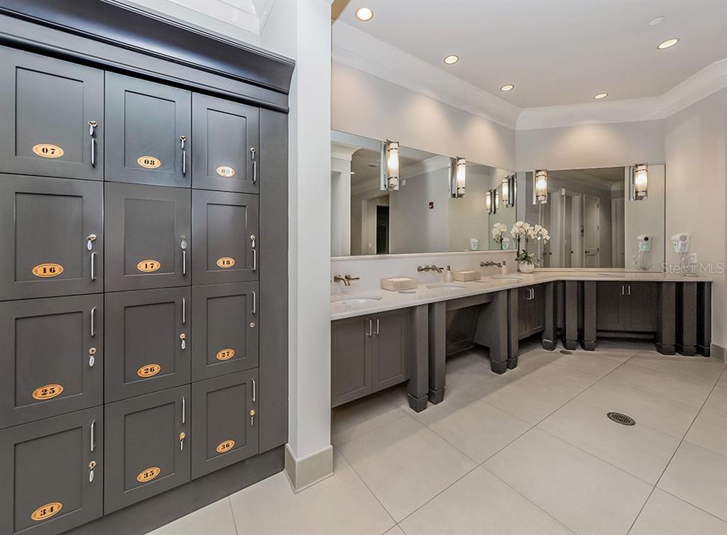16904 Vardon Terrace, Unit 301 Lakewood Ranch, FL 34211 - Photo 51 of 53 a large bathroom with a double vanity sink and mirror