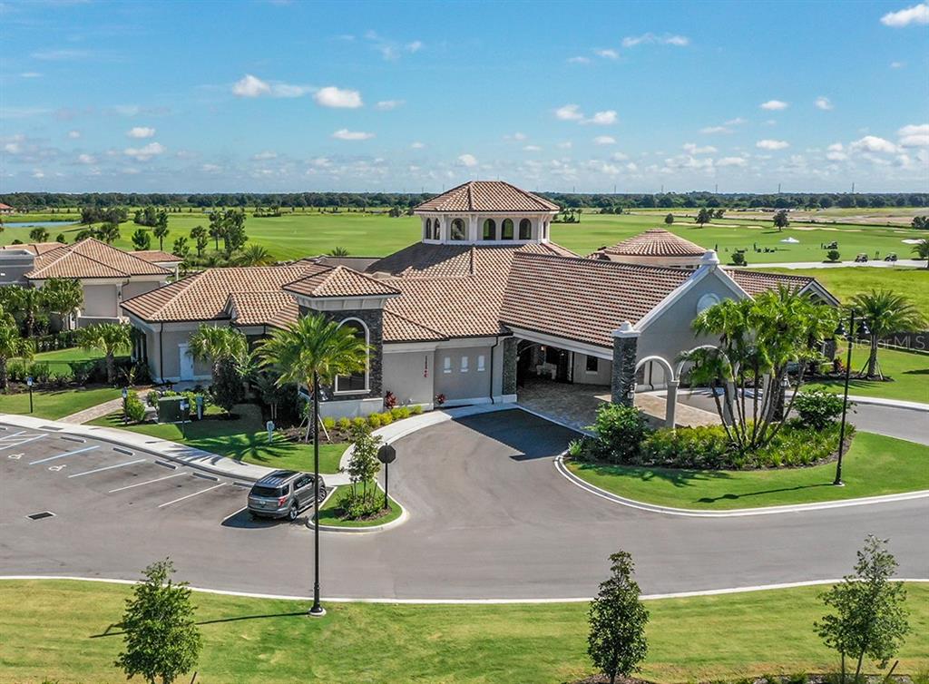 16904 Vardon Terrace, Unit 301 Lakewood Ranch, FL 34211 - Photo 52 of 53 an aerial view of a house with a garden and a swimming pool