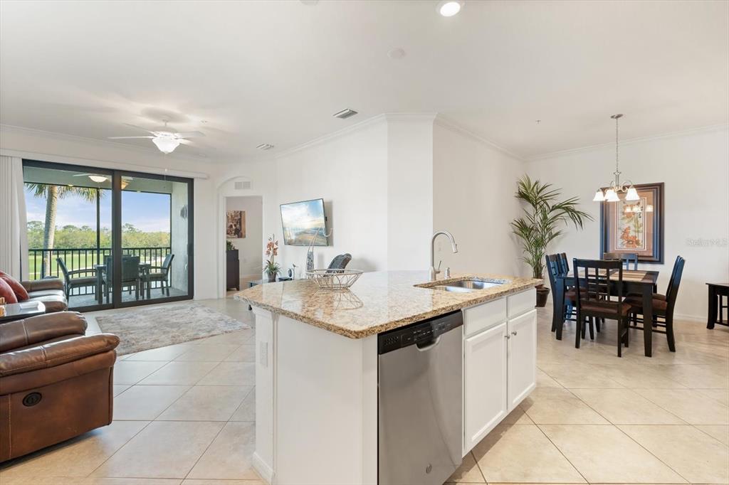 16904 Vardon Terrace, Unit 301 Lakewood Ranch, FL 34211 - Photo 10 of 28 a view of a kitchen counter top space with furniture and living room