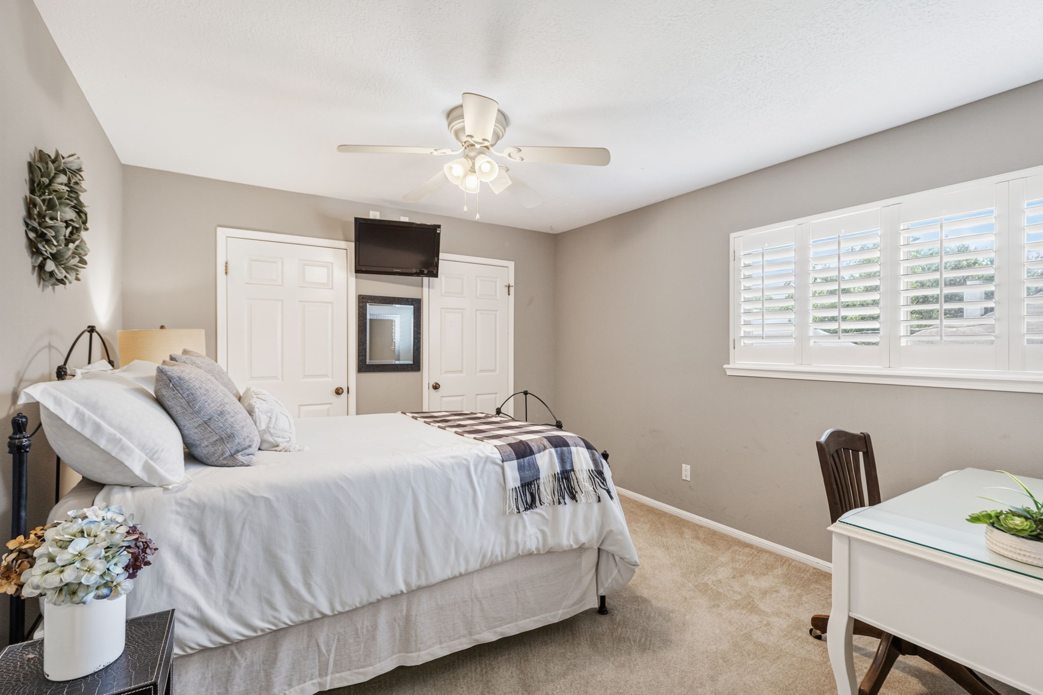 3414 Flaming Candle Drive Spring, TX 77388 - Photo 35 of 50 BEDROOM 3 - It has 2 closets and plantation shutters. The TV mounted on the wall can remain with the home.